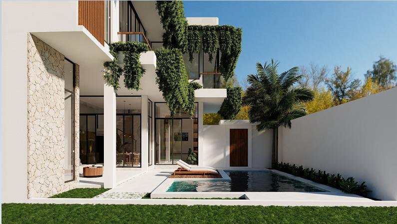Modern multi-story Bali villa exterior with a private swimming pool, sun lounger, and abundant hanging greenery on balconies. The villa features white walls, a natural stone accent wall, and large glass windows offering a view into the interior, all under a clear blue sky.