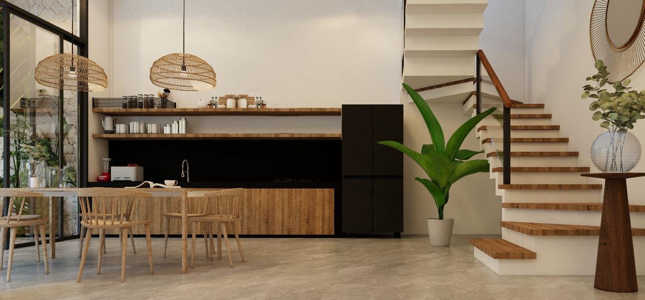 Modern open-plan kitchen and dining area in a Bali villa, featuring wooden furniture, woven pendant lights, and a staircase leading upstairs.